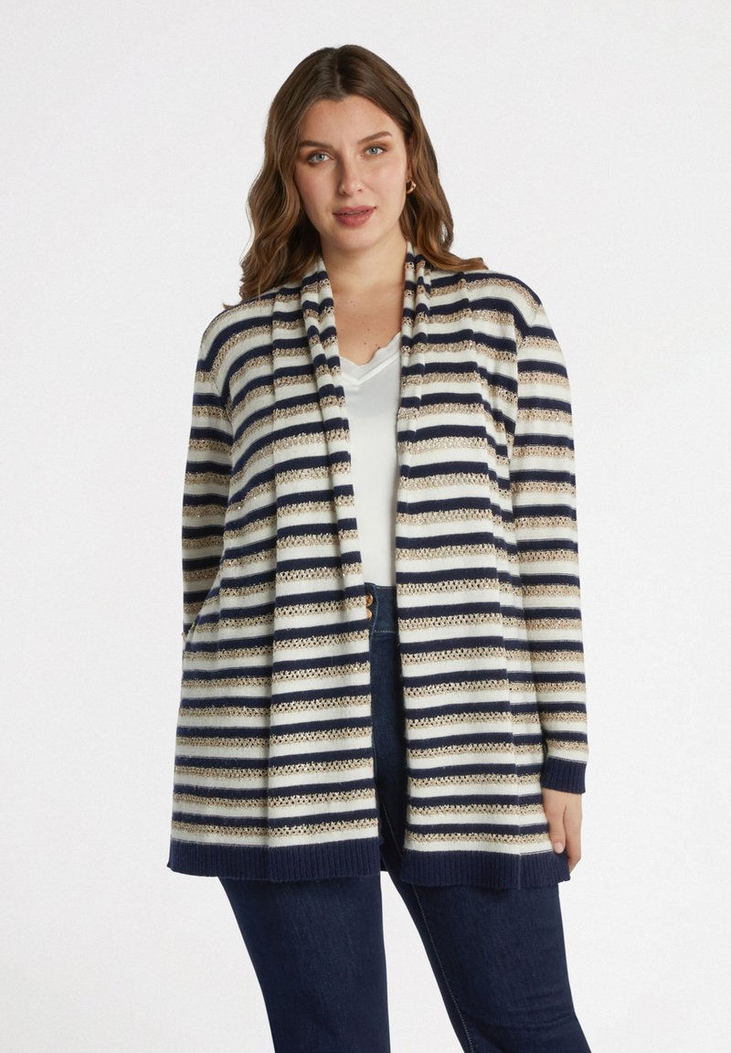 Raidallinen neuletakki avonaisella edellä, jossa on laivastonsinisiä, kerma- ja kultaisia raidat. Neulottu rakenne, pitkät hihat ja sivutaskut. Rentoa istuvuutta.