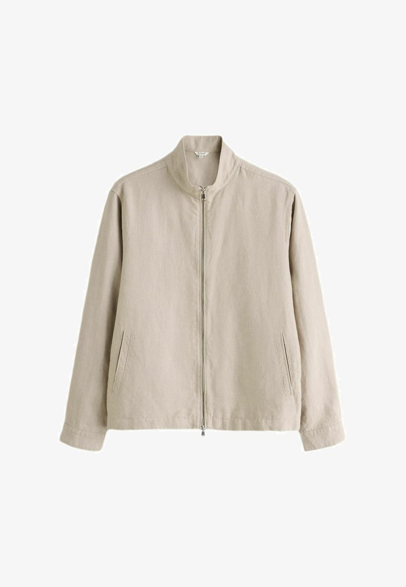 Veste décontractée beige à manches longues avec col montant, fermeture éclair avant et deux poches fendu latérales, fabriquée dans un tissu léger.
