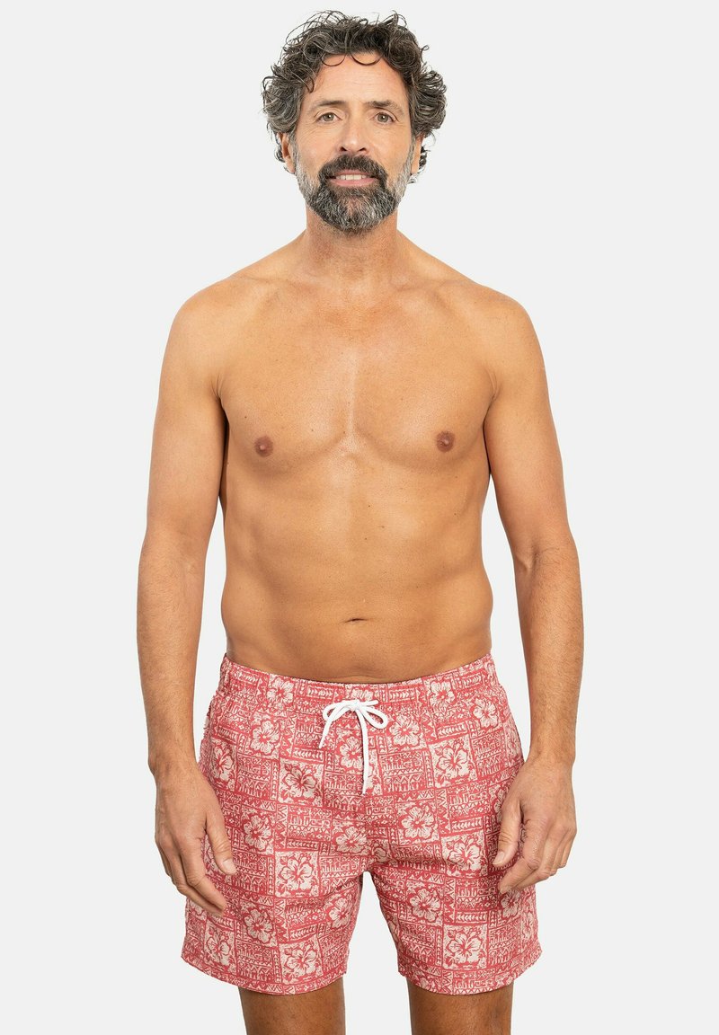 Bañador rojo con un patrón floral blanco, que cuenta con un cierre de cordón y un corte relajado. Tejido suave con una textura transpirable.