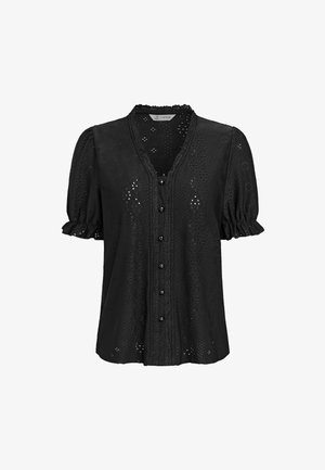 Blusa in pizzo con intagli neri, maniche corte a sbuffo, parte anteriore con bottoni, scollatura a V e dettagli con bordi smerlati.
