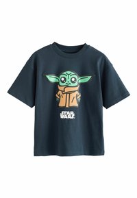 Dark blue t-shirt with a cartoon Baby Yoda wearing a brown robe and "Star Wars" text beneath the character on the front.