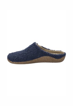 Navy blue slip-on clog made of textured fabric with a soft inner lining and a light brown, curved cork-like sole.