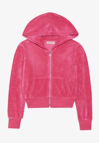 Sudadera con cremallera de terciopelo rosa, con bolsillos frontales, puños y dobladillo acanalados, y cremallera plateada con tirador en forma de corazón.