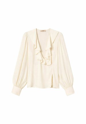 Blusa crema a maniche lunghe con profondo scollo a V, dettagli con balze a strati, polsini arricciati e piccolo spacco laterale.