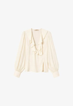 Blusa crema a maniche lunghe con profondo scollo a V, dettagli con balze a strati, polsini arricciati e piccolo spacco laterale.