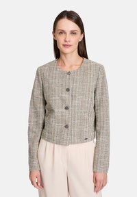 Woven blazer in a beige and gray check pattern, featuring a round neckline, long sleeves, and three circular buttons at the front.
