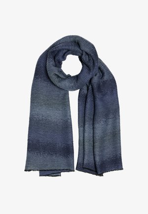 Soft, knitted scarf in varying shades of blue, wrapped in a circular loop with both ends hanging down.