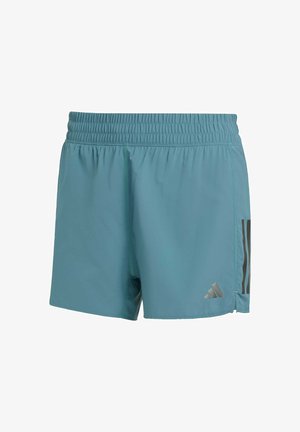 Pantaloni sportivi turchesi con elastico in vita, caratterizzati da strisce verticali scure e un piccolo logo riflettente sul lato destro in basso.