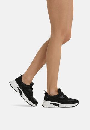 Scarpe sportive nere con tomaia testurizzata e finitura scintillante, suola bianca ammortizzata e design con lacci dotato di asole per una vestibilità sicura.