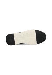 Black rubber shoe sole with a textured surface; features a white midsole and a distinctive tread pattern for traction.