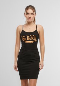Fekete spagettipántos ruha, narancssárga "Von Dutch Originals" felirattal. Testhez simuló fazon, sima textúra, térd alá érő hossz.