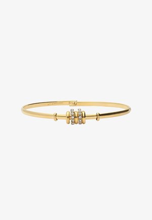 Gold-tone bangle bracelet with three circular accents featuring clear, embedded rhinestones. Smooth metal surface, sleek design.