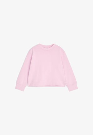 Sweat-shirt rose clair à manches longues avec col rond, poignets et ourlet côtelés, présenté à plat sur fond blanc.