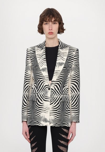 Blazer in stampa zebra nero e beige, design strutturato con rever affilati, chiusura con un solo bottone e due tasche frontali, realizzato con tessuto testurizzato.