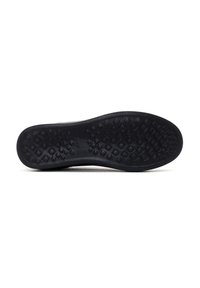 Suela de zapato de goma negra con un patrón texturizado que presenta formas de diamante elevadas para proporcionar agarre y tracción. Diseño plano sin marcas visibles.