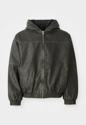 Dark leather bomber jacket with a hood, elastic cuffs, and waistband. Features a front zip and two side pockets. Textured finish with stitching detail.