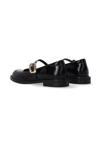 Black patent leather shoes with a rounded toe, decorative buckle strap, and low rubber heel. Smooth texture and minimalistic design.