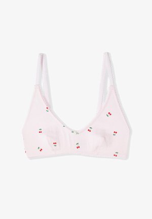 Hellrosa weicher Stoff-BH mit dünnen verstellbaren Trägern und kleinen roten Kirschmustern, die über den BH verteilt sind.