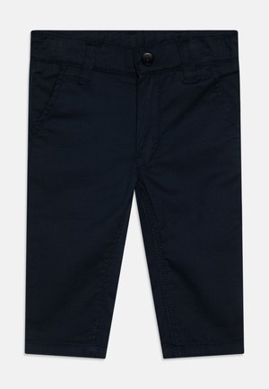 Navyblauwe katoenen broek in een mix van stoffen met een knoopsluiting, riemlussen, vier zakken en zichtbare stikseldetails. Rechstreeks ontwerp.