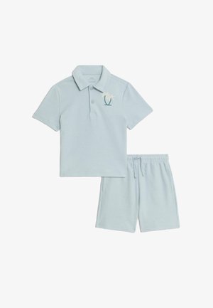Light blue short-sleeve polo shirt with palm tree embroidery paired with matching drawstring shorts for casual wear.
