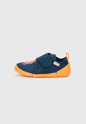 Navy blue and orange toddler shoe with Velcro strap, orange sole, animal design on toe, and pull tab on heel against white background.