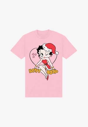 Różowa bawełniana koszulka z nadrukiem postaci z kreskówek w czapce Świętego Mikołaja, otoczona serduszkami oraz napisem "BETTY BOOP" w kolorze żółtym.