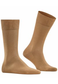 Beige Socken aus glattem, dehnbarem Material. Sie haben einen gerippten Bund und eine nahtlose Zehenpartie und zeichnen sich durch ein klassisches Design aus, das sich für den täglichen Gebrauch eignet.