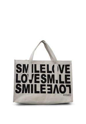 Lærredstote taske i lys beige med fed sort tekst: "SMIL ELSK ELSK SMIL." Dobbelt top håndtag og lynlås lukning.