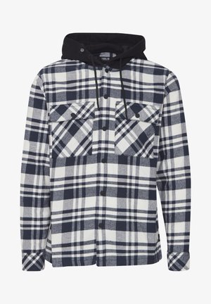 Navi ja valge ruudulise flanellist särk musta kapuutsiga. Omadusteks on kaks nööbitavat rinnataskut ja lõdvem lõige koos ruudumustritega.