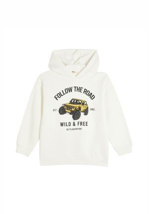 Sudadera blanca con capucha que presenta un gráfico de un vehículo todoterreno amarillo y el texto "SIGUE EL CAMINO SALVAJE Y LIBRE" en negro.