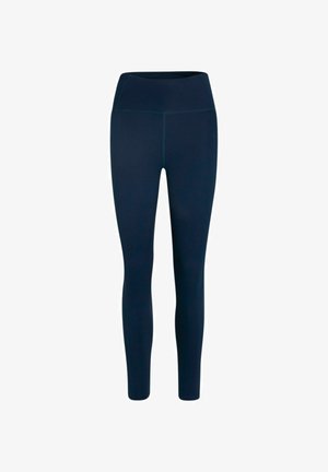 Námornícke modré legíny vyrobené z elastického materiálu. Vysoký pás so priliehavými nohami, s jemnými švami a hladkou textúrou.