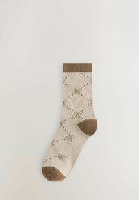 Beige Sock mit braunem geripptem Bund, versehen mit einem Muster aus braunen Punkten und stilisierten 'M'-Designs. Aus Baumwollmischung.