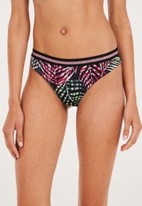 Bikini apatiniai su juodu pagrindu, puikiai derančiais ryškiais rožiniais ir žaliais tropiniais lapų raštais, siaura juoda juosmens juosta su metaliniu akcentu.