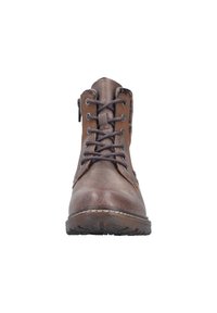 Bottine en cuir marron avec lacets plats, bout arrondi, coutures renforcées et fermeture éclair latérale. Surface texturée et semelle en caoutchouc avec bande de roulement.