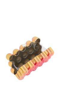 Átlátszó clutch táska lekerekített arany és rózsaszín díszítésekkel, sima külső felülettel és záródónak megfelelő csattal. Egyedi buborék szerű dizájn.