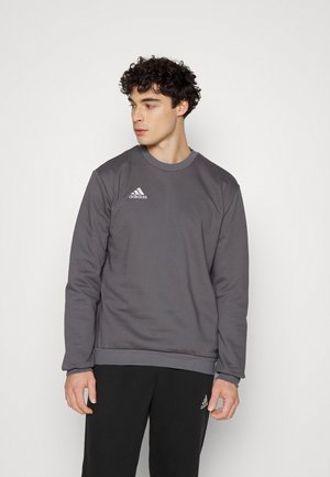 Gray sweatshirt made of cotton blend, featuring a crew neckline and ribbed cuffs. Adorned with a small white Adidas logo on the chest.