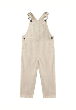 Salopette beige en coton avec bretelles ajustables, poche poitrine à l'avant, boutons latéraux et deux poches latérales.