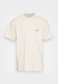 Cream-colored cotton t-shirt with short sleeves, round neckline, and a small orange and red logo on the left chest area.