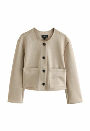 Beige faux suede cropped jacket with ribbed round neckline, button closure, and two front patch pockets. Features long sleeves and smooth texture.