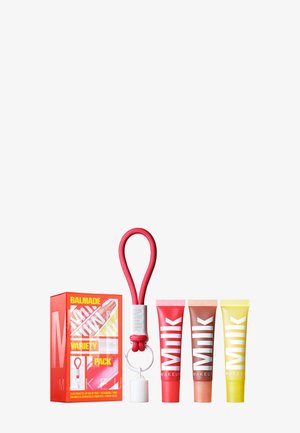 Variety pack featuring three small, colored lip balm tubes in red, pink, and yellow, alongside a red looped carrying strap and a bold box design.