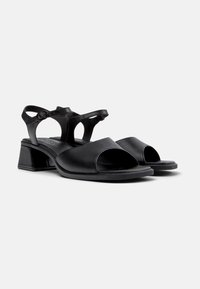 Black leather sandals with a matte finish, featuring an open toe design, wide upper straps, and a block heel for stability.