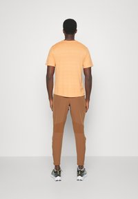 Nike Performance ELITE - Calças - ale brown/silver