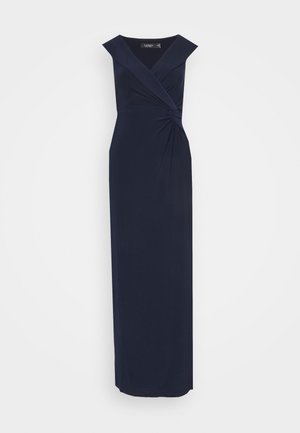 Navy long dress featuring a V-neck, cap sleeves, twisted knot detail at the waist, and a smooth, flowing fabric.