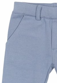 Heledsinine puuvilla ja elastaani segu jogger püksid, millel on vöökoht, küljetaskud ja tekstureeritud pind. Kohandatud lõdva istuvuse jaoks.