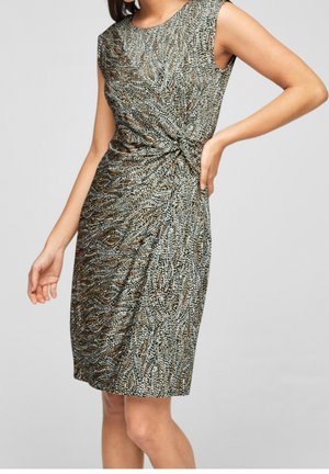 Robe sans manches longueur genou avec un détail de taille torsadée présentant un motif abstrait à pois dans des tons noirs, blancs et marrons.