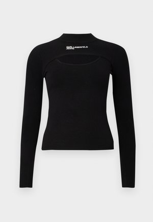 Čierny dlhý rukáv top vyrobený z ribbovaného materiálu. Má vysoký golier a výrez na hrudi. Text loga na pleci.