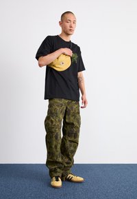 Carhartt WIP DUCK PANT - Pantaloni cargo - green/office green