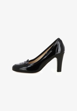 Pantofole con tacco medio in vernice nera per donna, con punta rotonda e dettagli decorativi sulla fascia, su uno sfondo bianco.