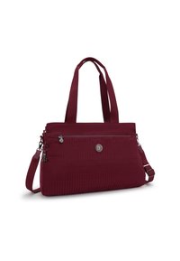 Burgundy olkalaukku, joka on valmistettu rakenteellisesta kankaasta, jossa on kaksi pitkää kahvaa, säädettävä hihna, etutasku vetoketjulla ja pyöreä logotunnus.