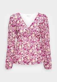 Blouse à manches longues avec imprimé floral rose, violet et beige, col en V, détail froncé sur la poitrine et poignets élastiques aux manches.